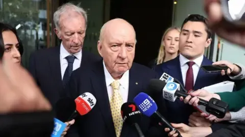 Sexual Assault Charges Against Prominent Down Under Broadcaster Downgraded